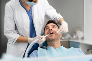 Dentist doing a check up on the patient at Bite Club
