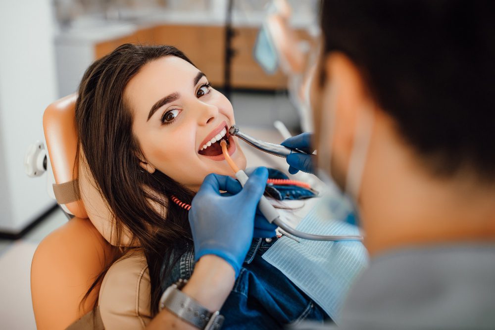 Young female patient visiting dentist office at Bite Club